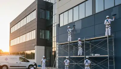 Professional commercial painters finishing office exterior in Boise, ID for durable business appeal